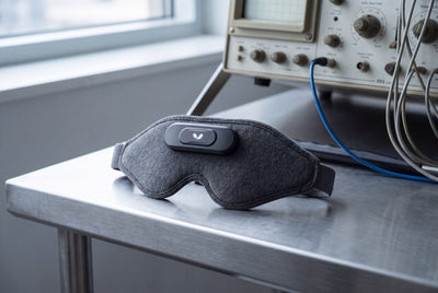 Domayn Mask on a steel lab table beside a vintage EEG oscilloscope